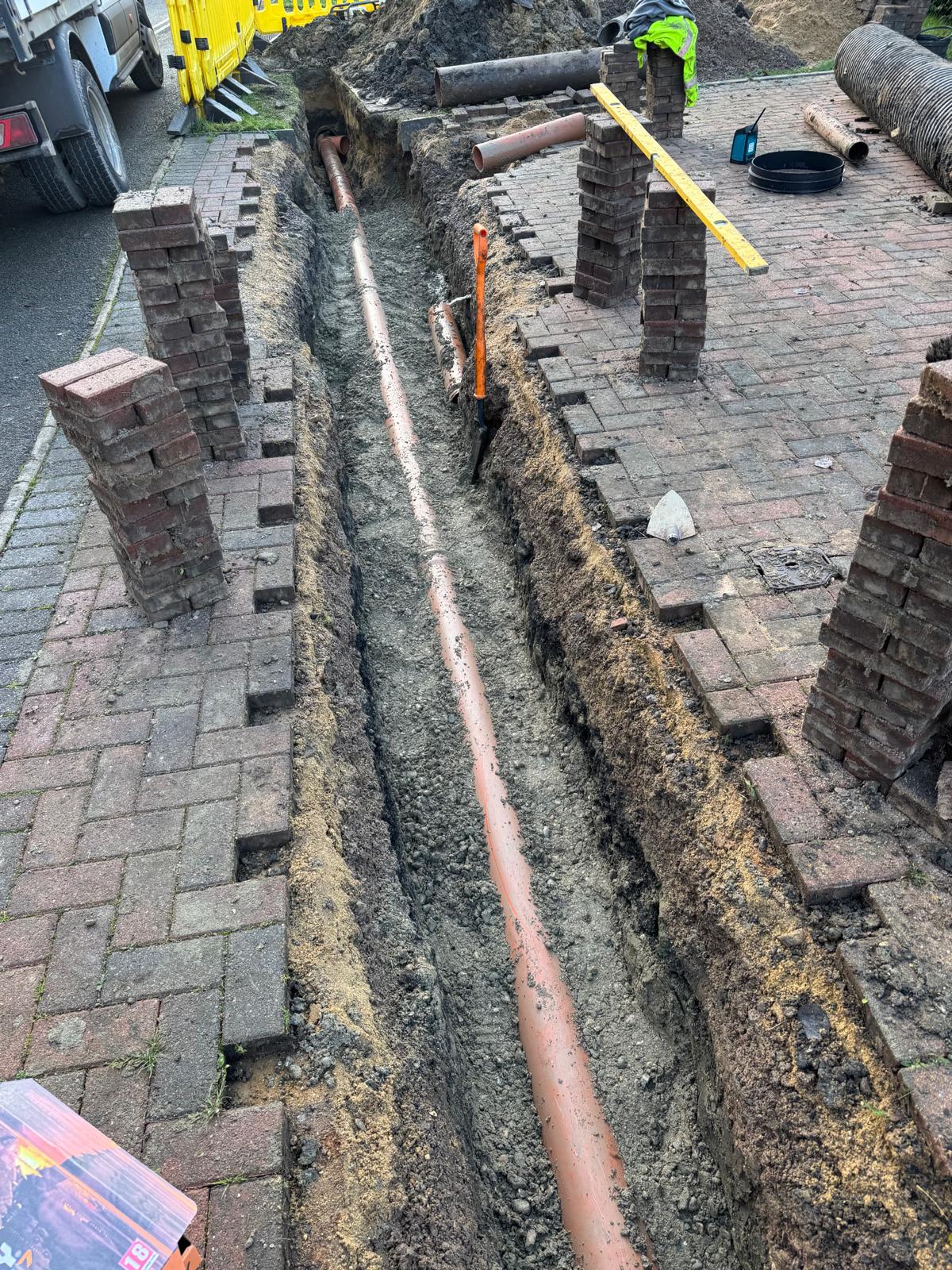 Installation of new orange drainage pipes