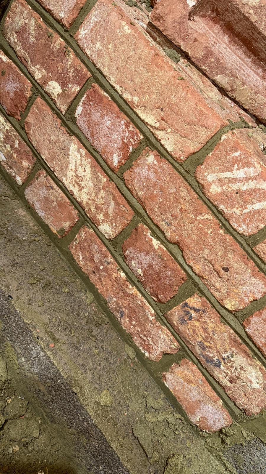 Close up of fresh mortar and quality brickwork