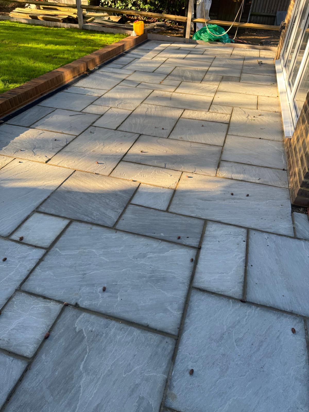 High-quality stone patio paving installation